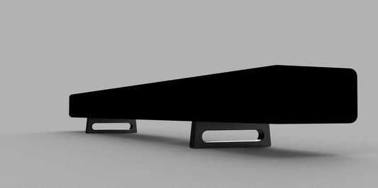 Black soundbar shown on a pair of raised supports with open cable space underneath